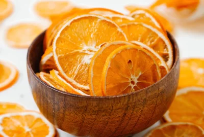 front-view-dried-orange-rings-sweets-inside-outside-little-plate-white-desk-fruit-dry-raisin-color_140725-26092